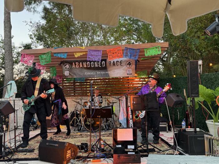 Outdoor stage, string lights and papel picado